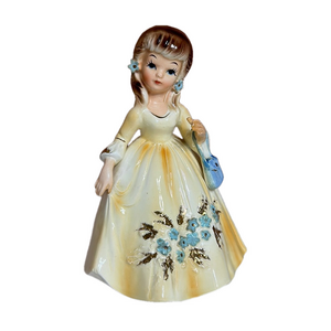 MARIKA'S LEFTON original girl in yellow dress with blue purse and blue flowers